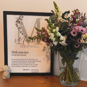 Hebamme und Blumen Bild